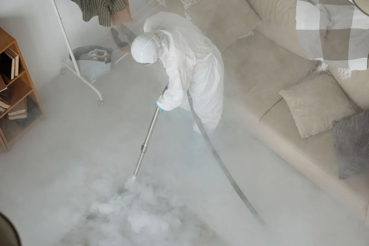 Biohazard cleanup technician in protective equipment, College, AK